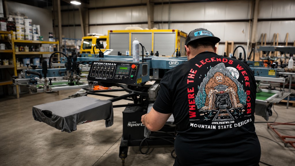 A screen printer working at an automatic press